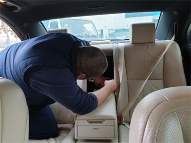 ITV import tech makes etching of stamped chassis number on Mercedes S320 L ITV technician inside Mercedes S320 L